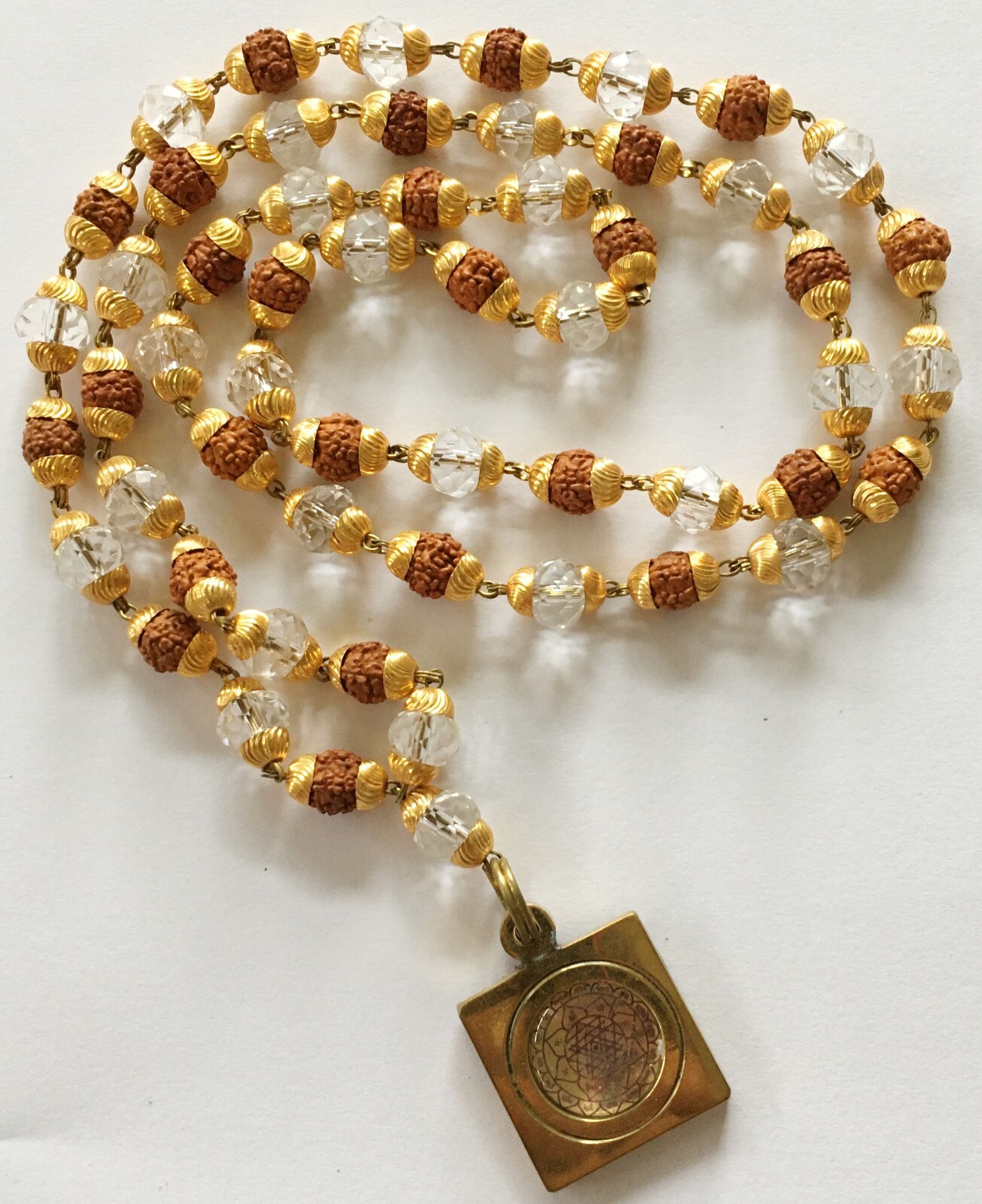 Rudraksha and Crystal Golden Cap Mala 54 Count with Sampoorna Sri Yantra Pendant