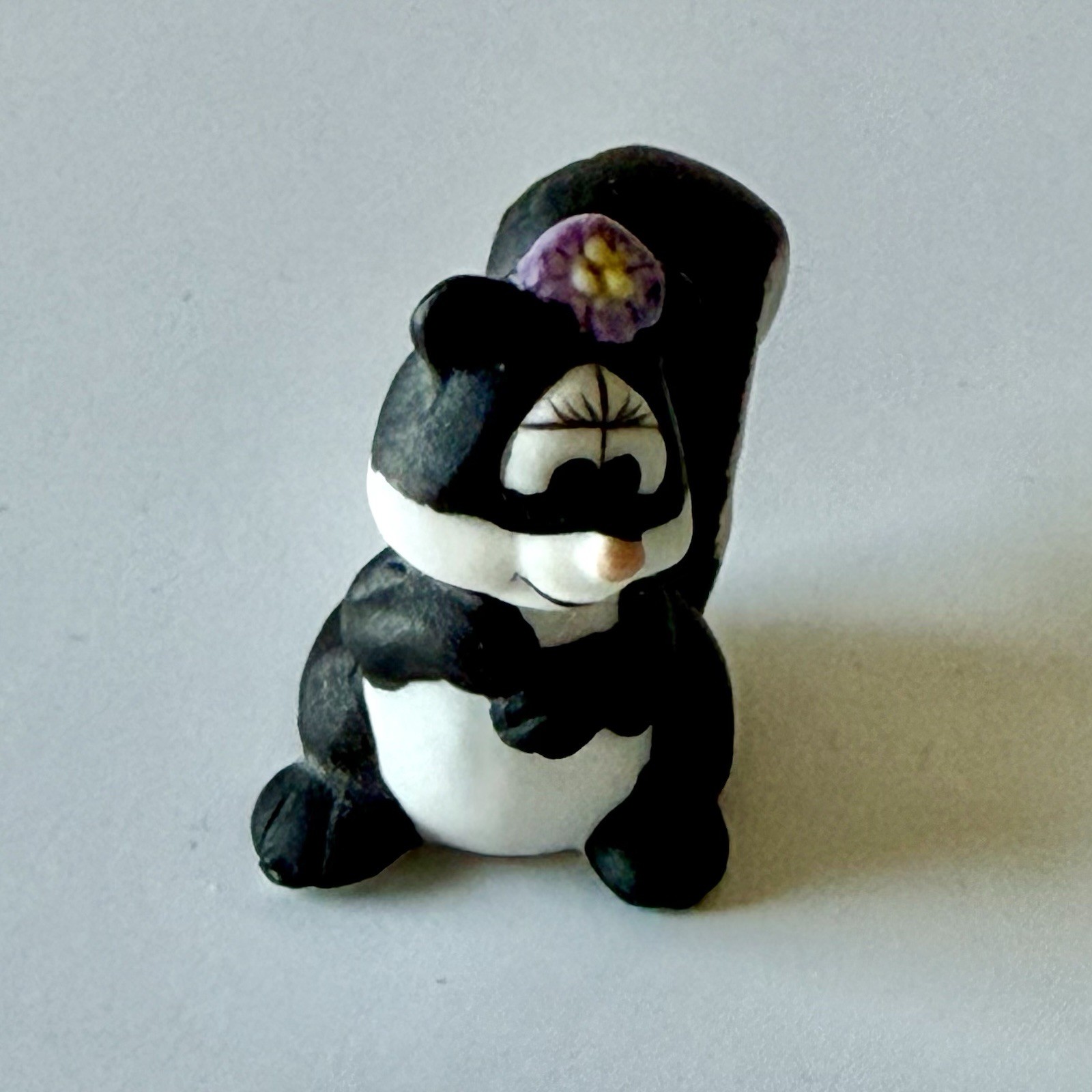 VNTG Mini Porcelain SKUNK Figurine Hand Painted Matte Finish w/Flower Mid-Centur