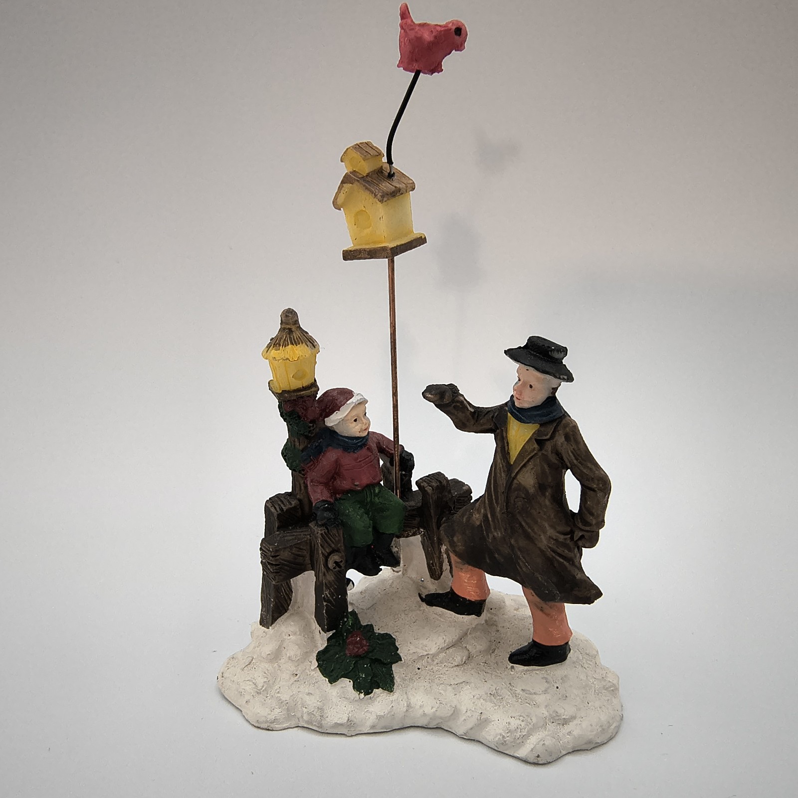 Victorian Christmas Villagers figurine Father w/ Child, Birdhouse, And Bird 4″