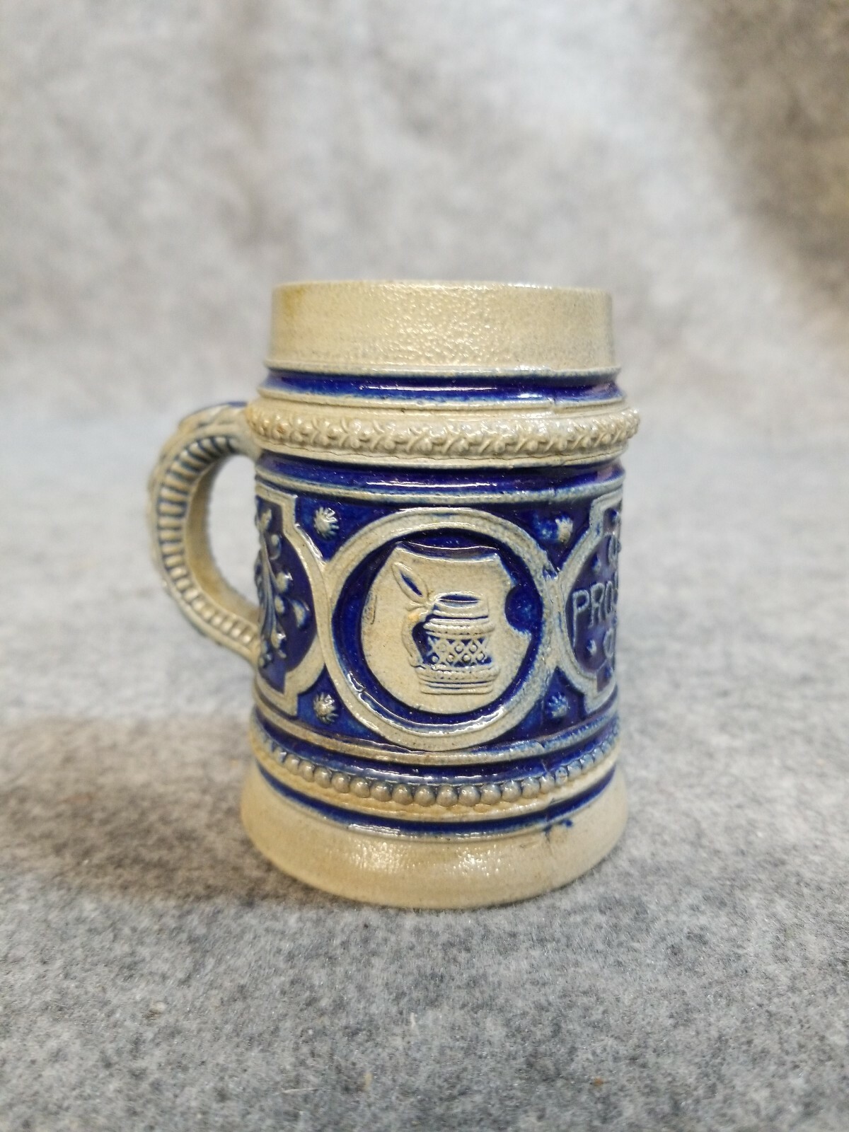 3 1/4 inch tall Stein made in Germany “Prosit” Cheers to your health.