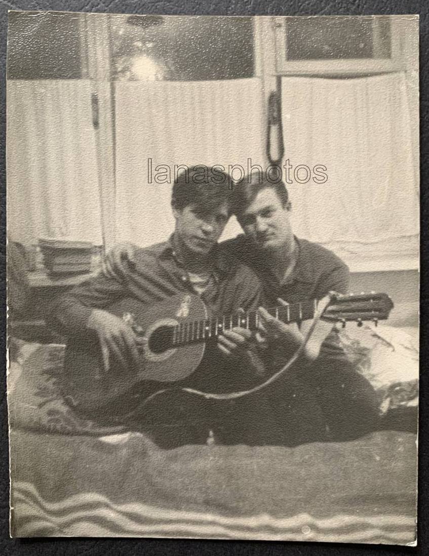 Guitar Handsome men Bed Bedroom Affectionate couple hugs closeness photo Gay Int