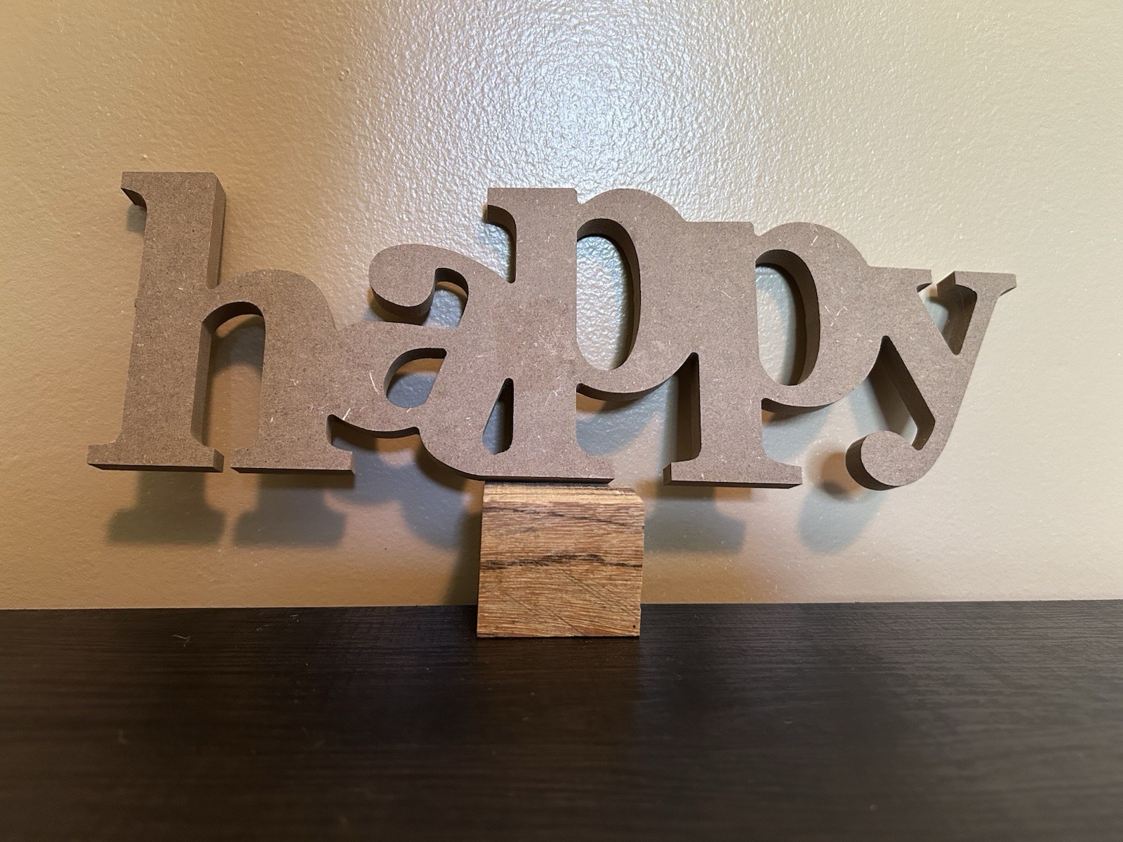 Hanging decorative “happy” wall decor piece. Hooks for hanging.