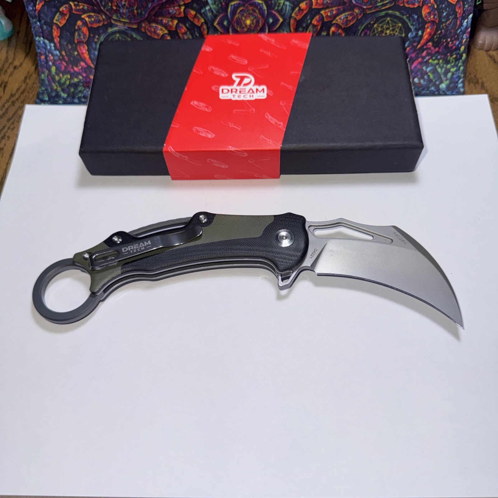 Dreamtech Karambit Button Lock. Back Flip. 14C28 Sandvik. G10 Handle D4221GBG