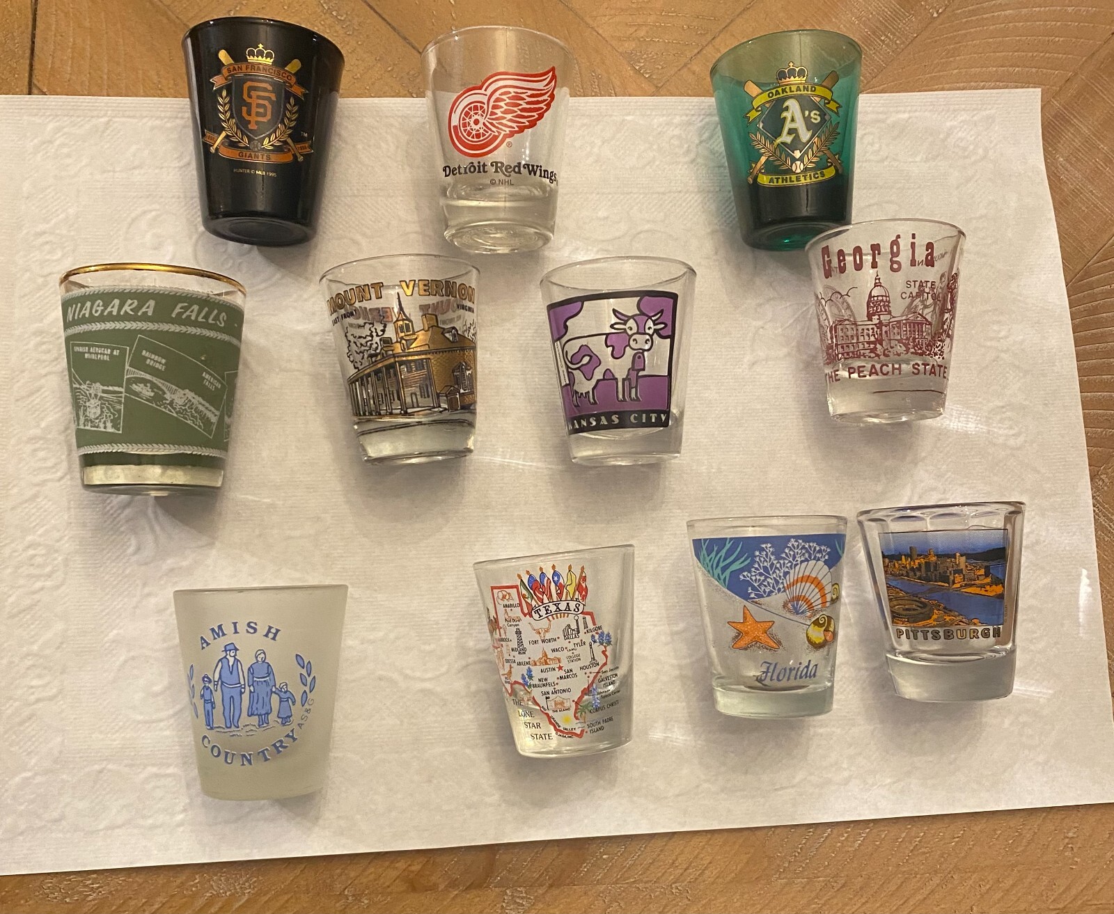 Shot Glass LOT of 13 – Baseball, Hockey, Large Cities, Niagara Falls, FL, ETC
