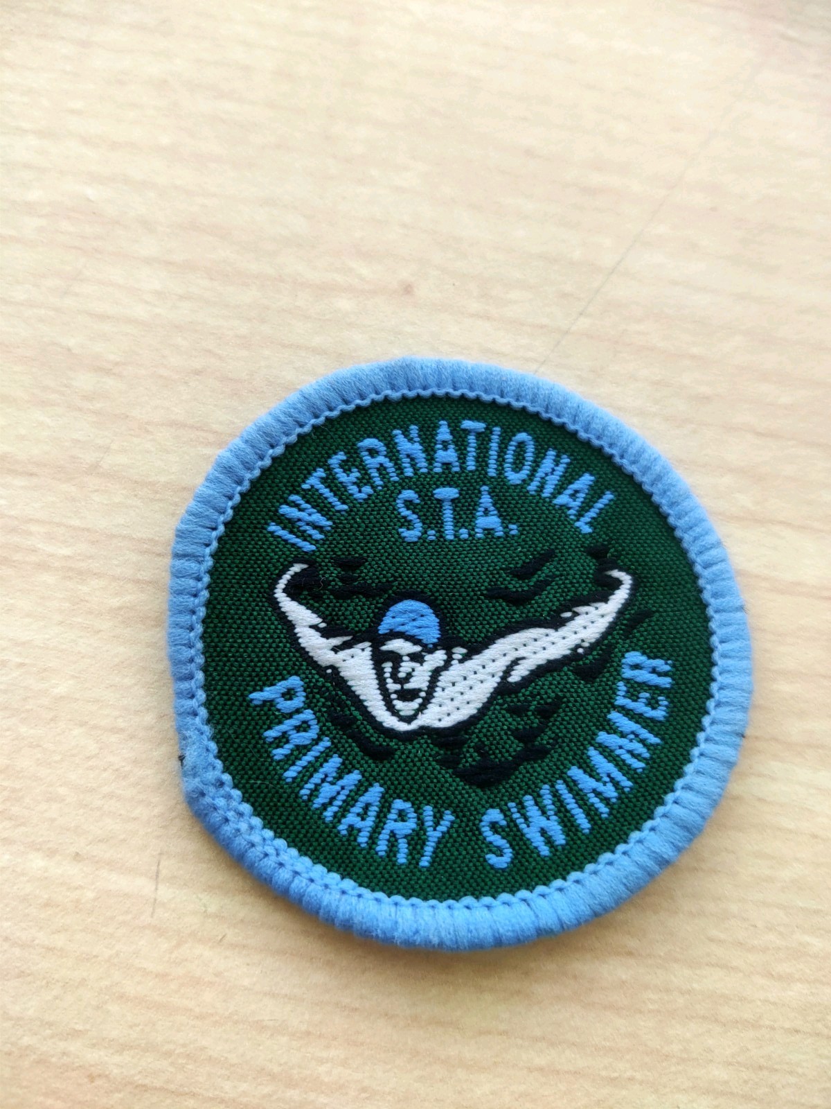 Vintage 1980’s International S.T.A Primary swimmer swimming badge. Never Used.