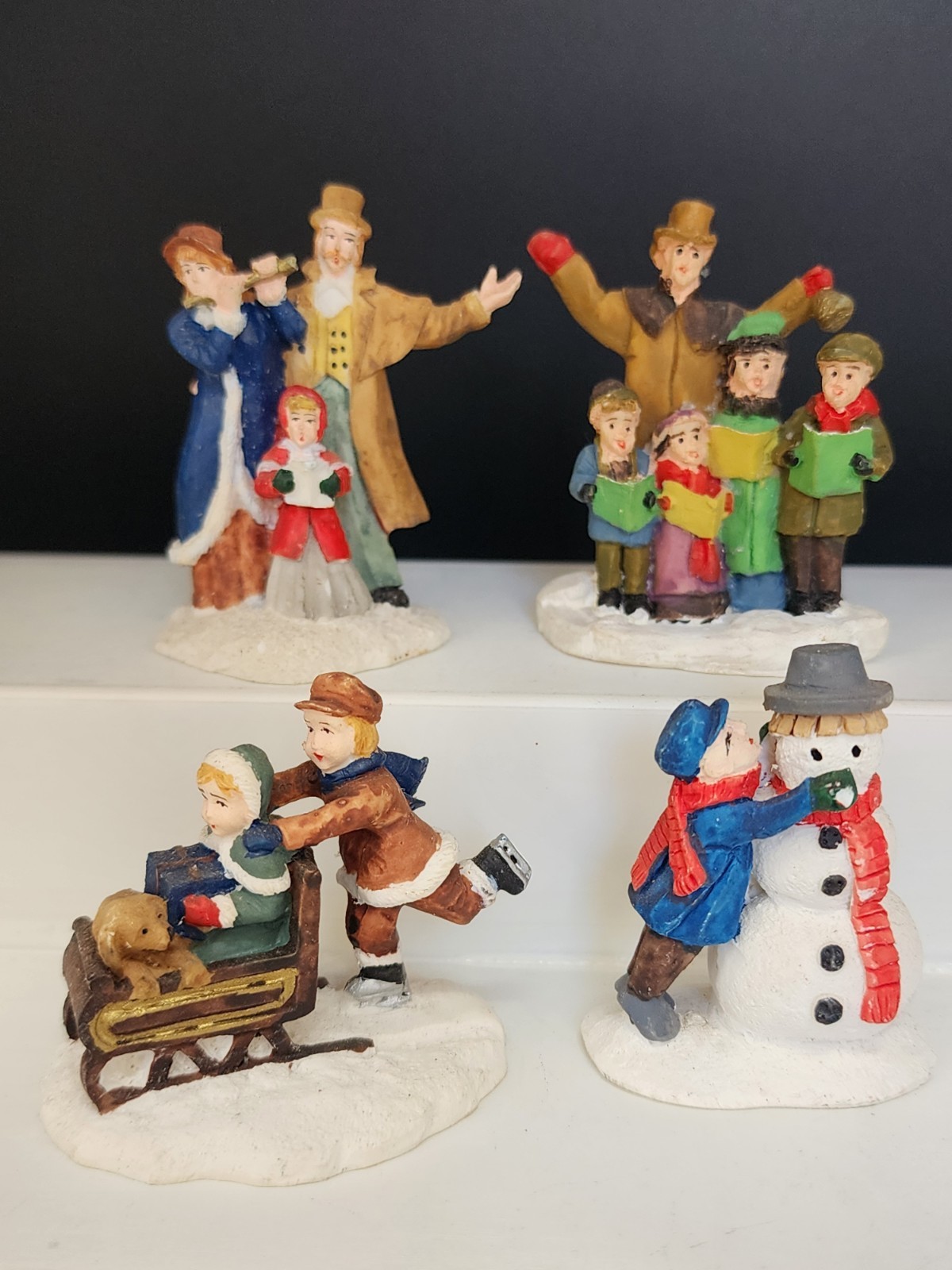 Vintage Lot 4 Christmas Village Figurines Boys Girls Adults Snowman Carolers