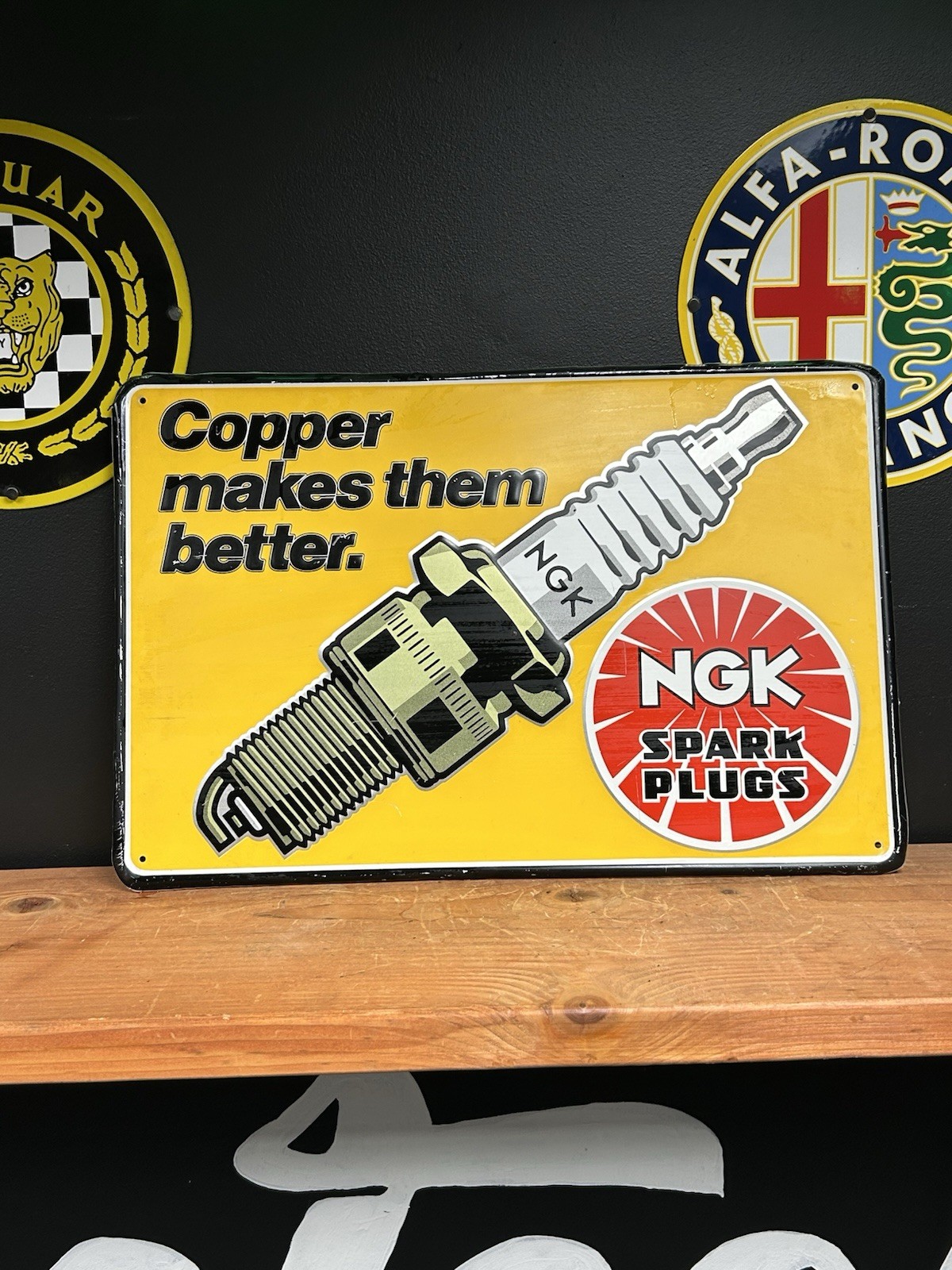 NGK Spark Plugs Copper Makes Them Better Painted Metal Embossed 16 x 24″