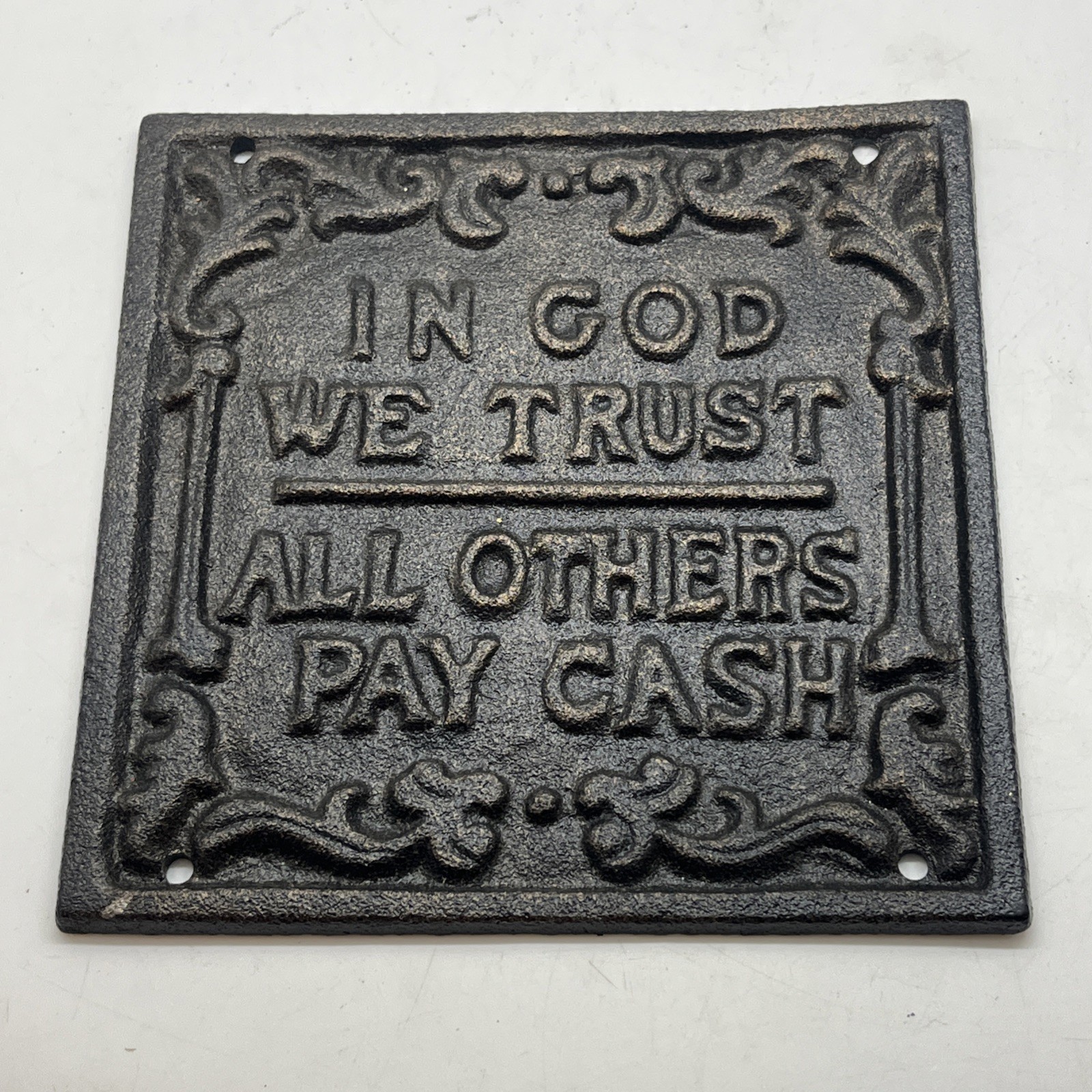 VINTAGE TRIVET Black Cast Iron Square Plaque In God We Trust All Others Pay Cash