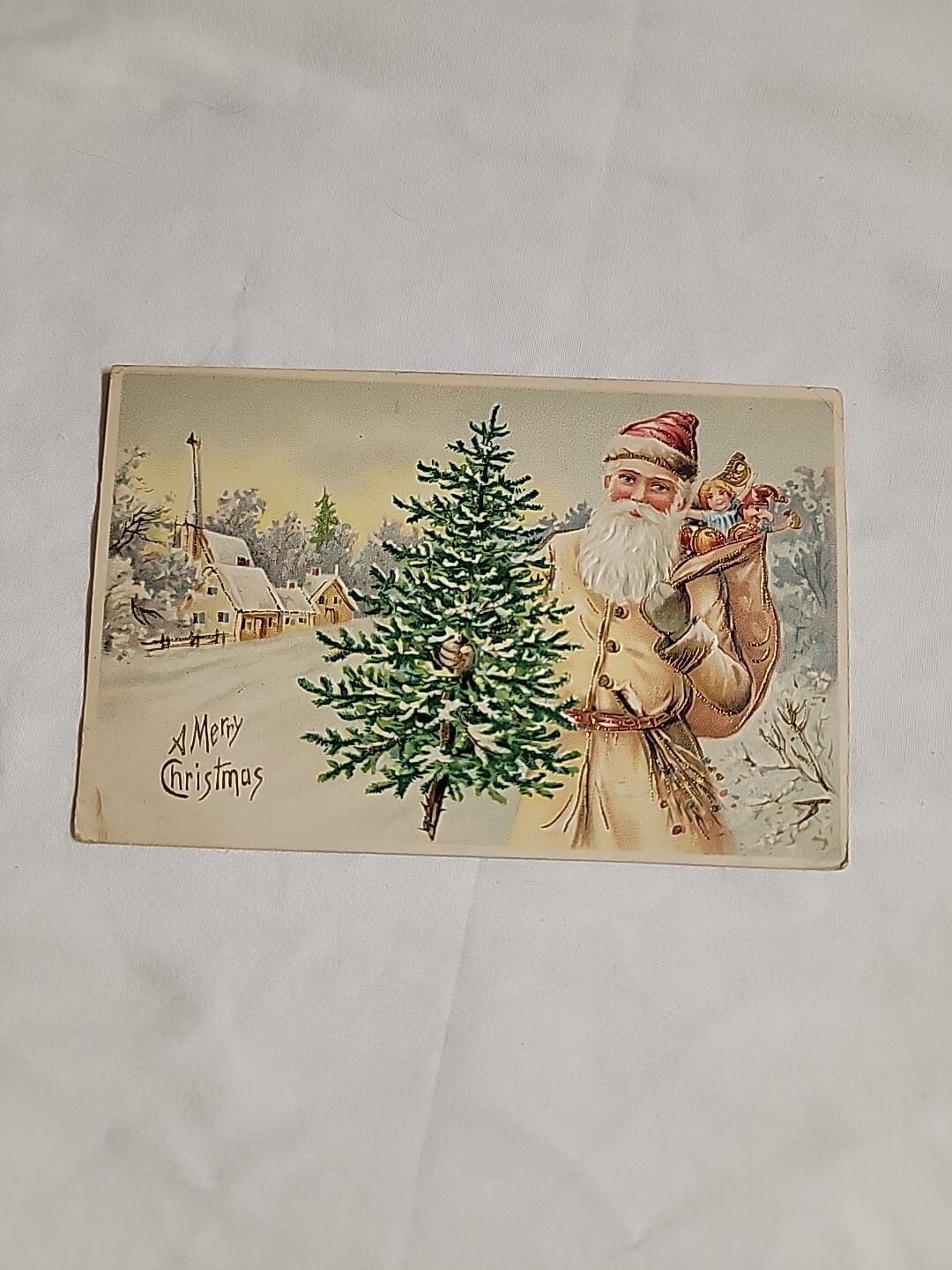 Postcard 1907 Christmas 295 Beige Tan Santa Red Hat Holds Tree Church Nice Stamp