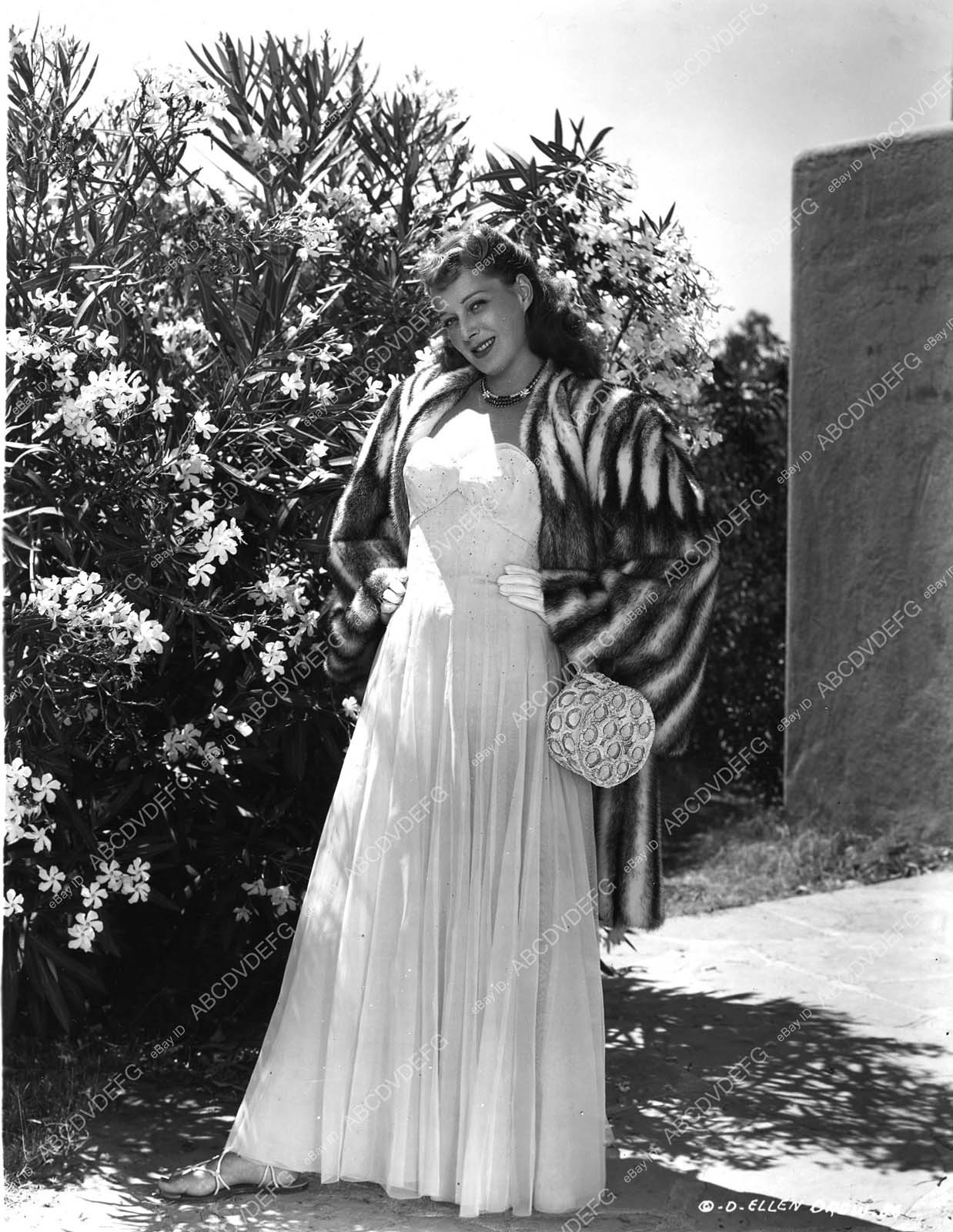 { Ellen Drew in white dress fur coat ready to go out dp-11975 – dp-11975