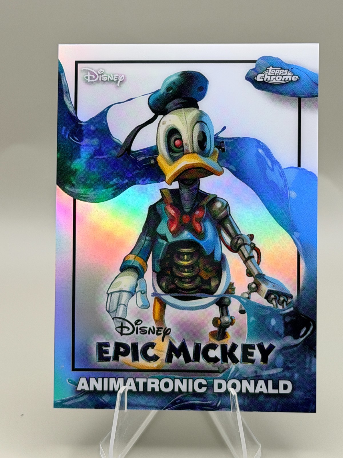 2026 Topps Disney Chrome Neon: EM-15 EPIC MICKEY Animatronic Donald