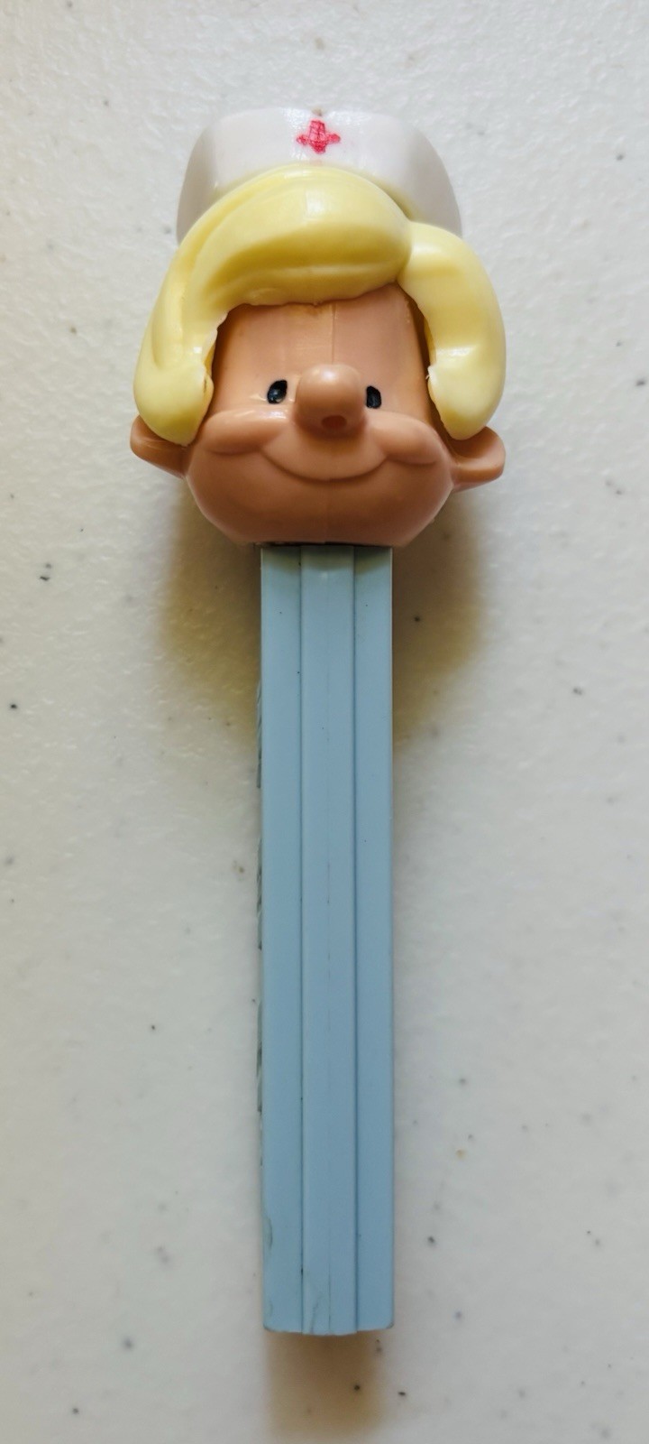 Vintage BLONDE NURSE – PEZ Dispenser – No Feet US Pat 3.8 Light Blue Base (USA)