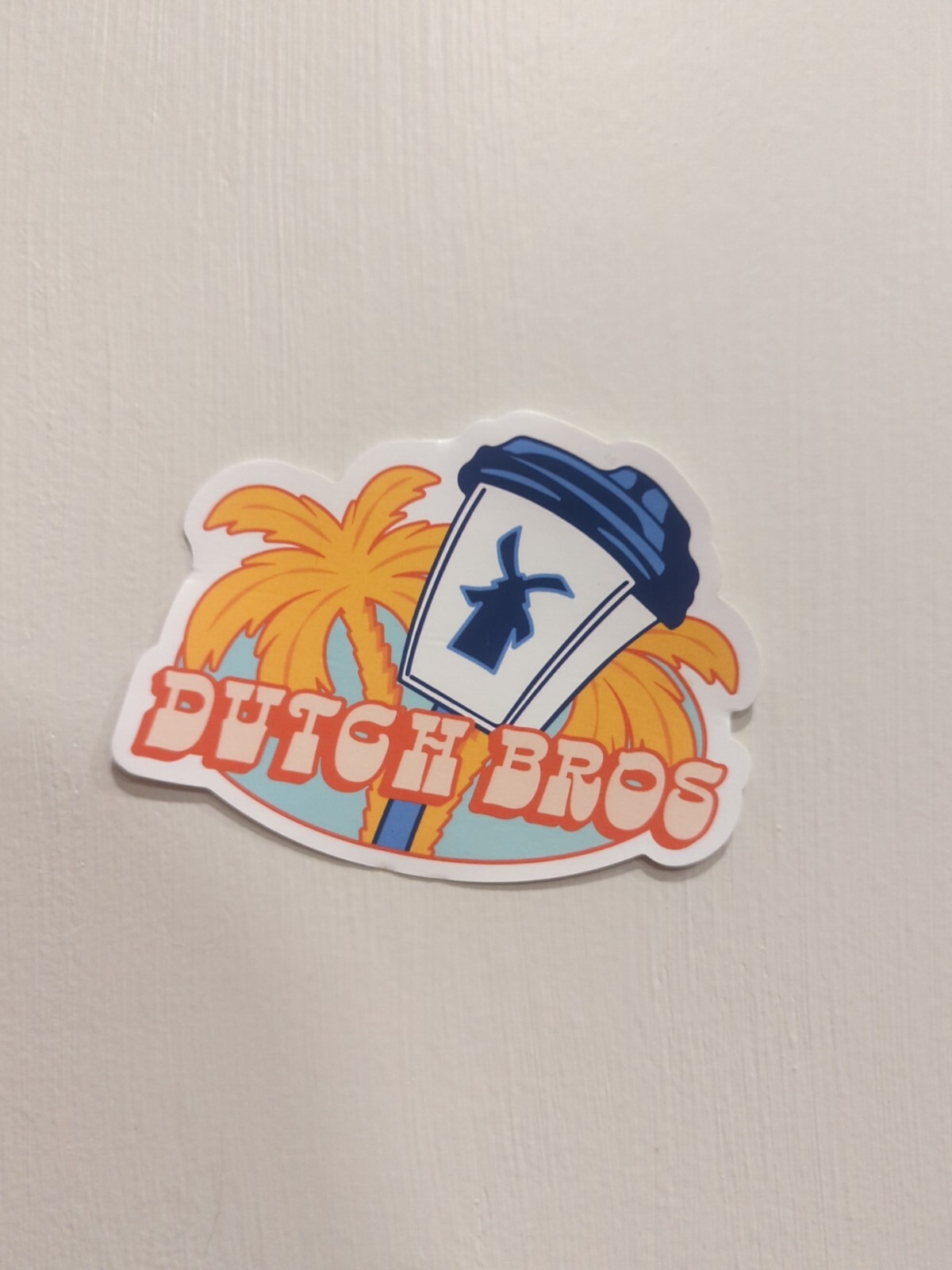 BULK DISCOUNT; FOR CHARITY Dutch Bros Sticker June 2024 Windmill Palmtree Orange