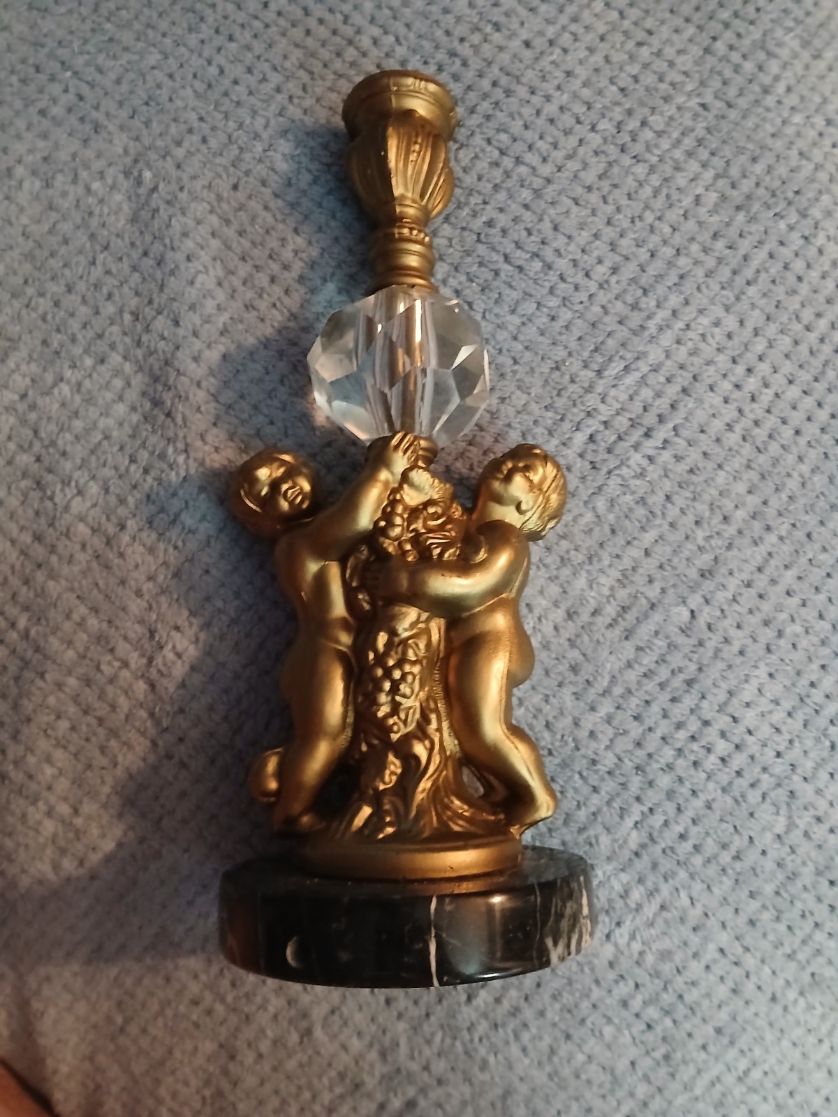 vintage table candle holder with cast cherub figures 10inches tall with crystal