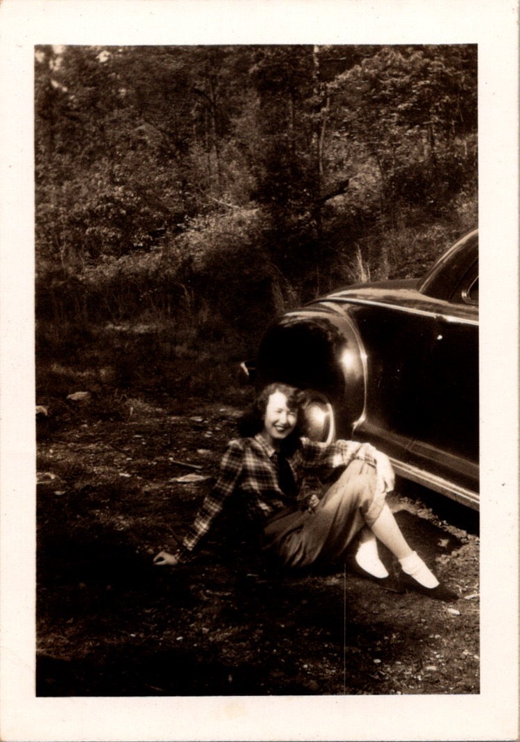 Vintage 1949 Photo Young Woman Smiling Next to Car Woods Outdoor Snapshot B&W