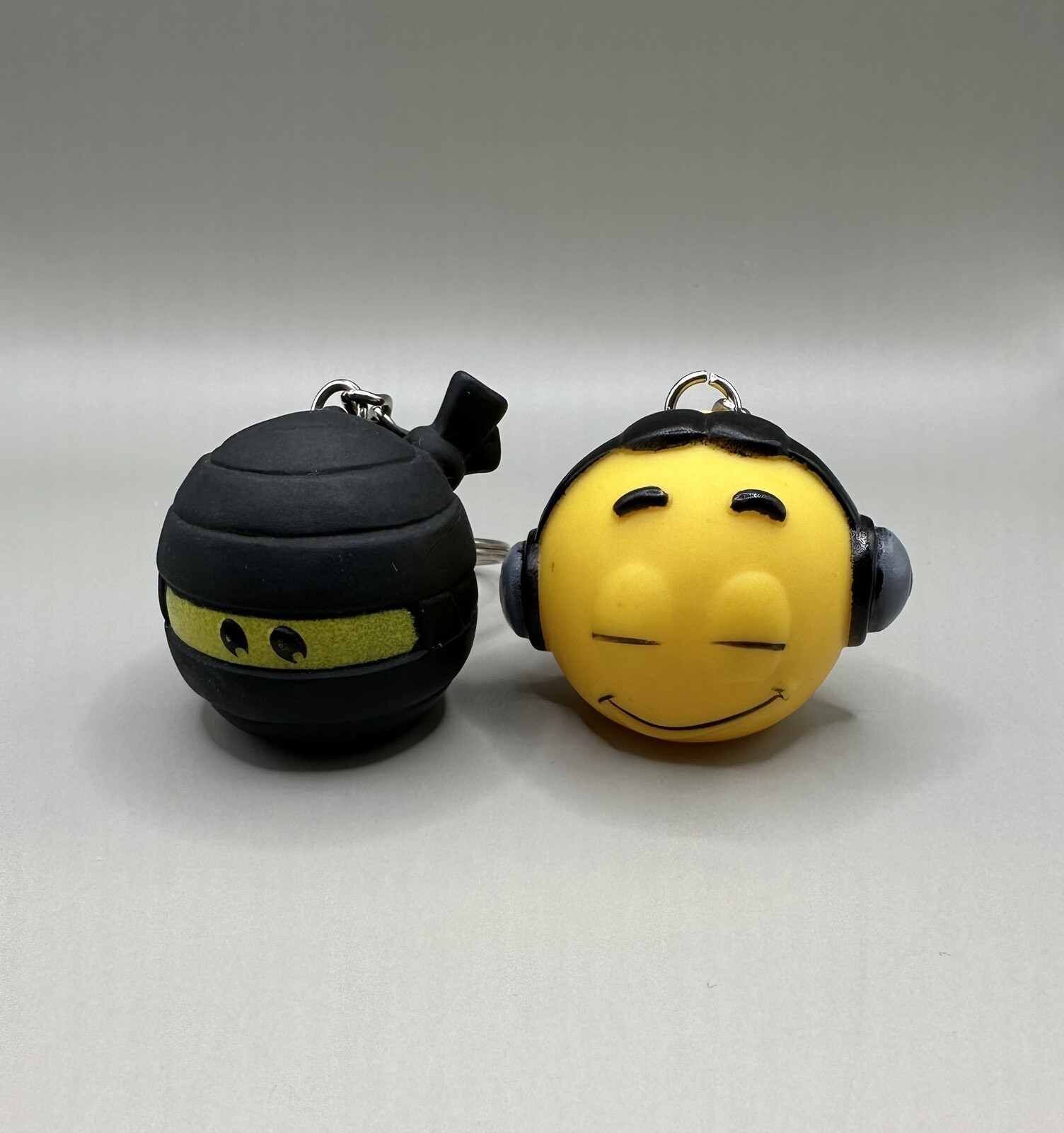 2 Emoji Keychains Ninja Headphones Vinyl PVC Hard Plastic Keyring