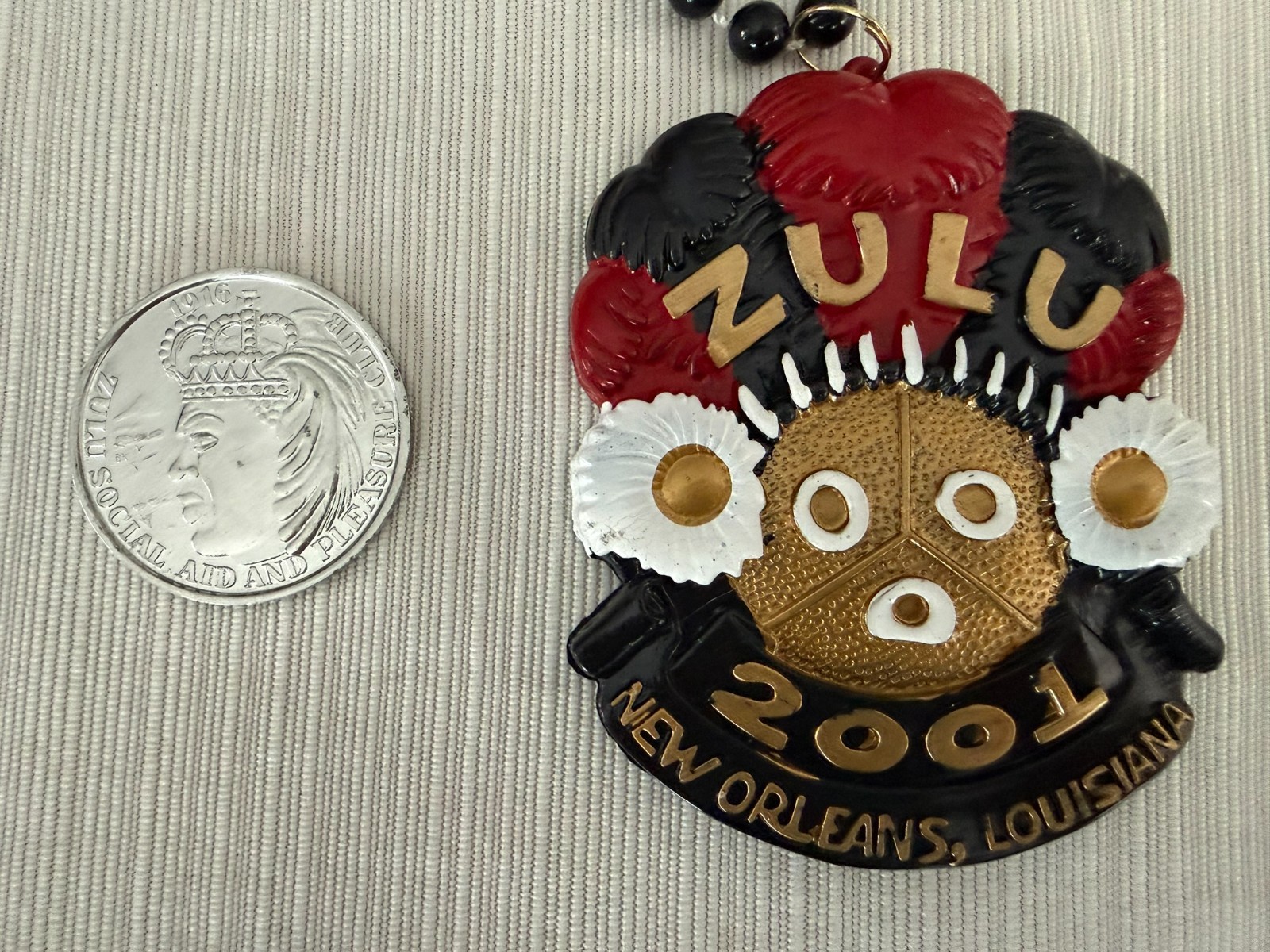 Mardi Gras Beads and medallion, Krewe of Zulu, New Orleans 2001