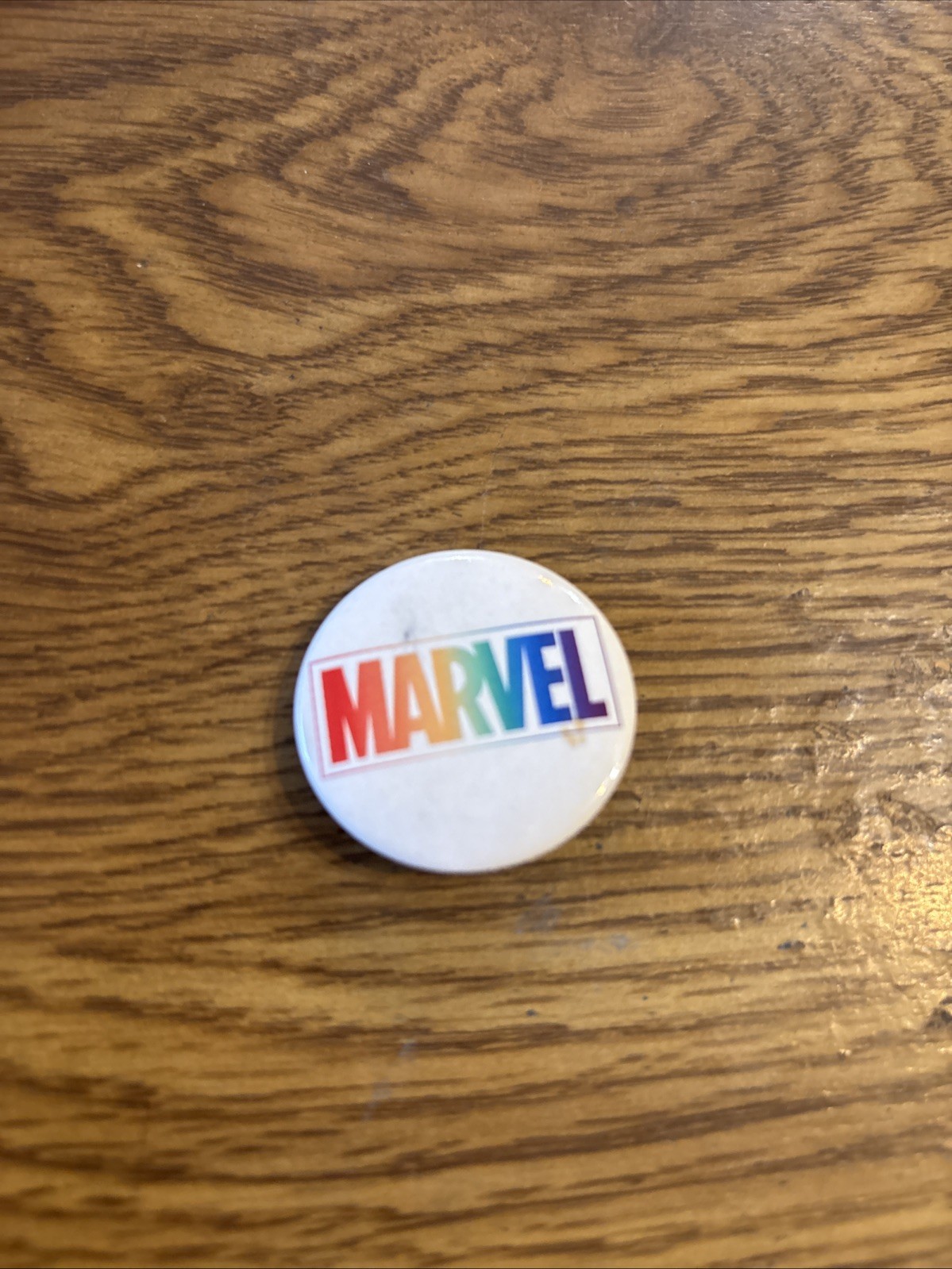 Marvel Comics, White With Rainbow Colors Pin 1-1/4″