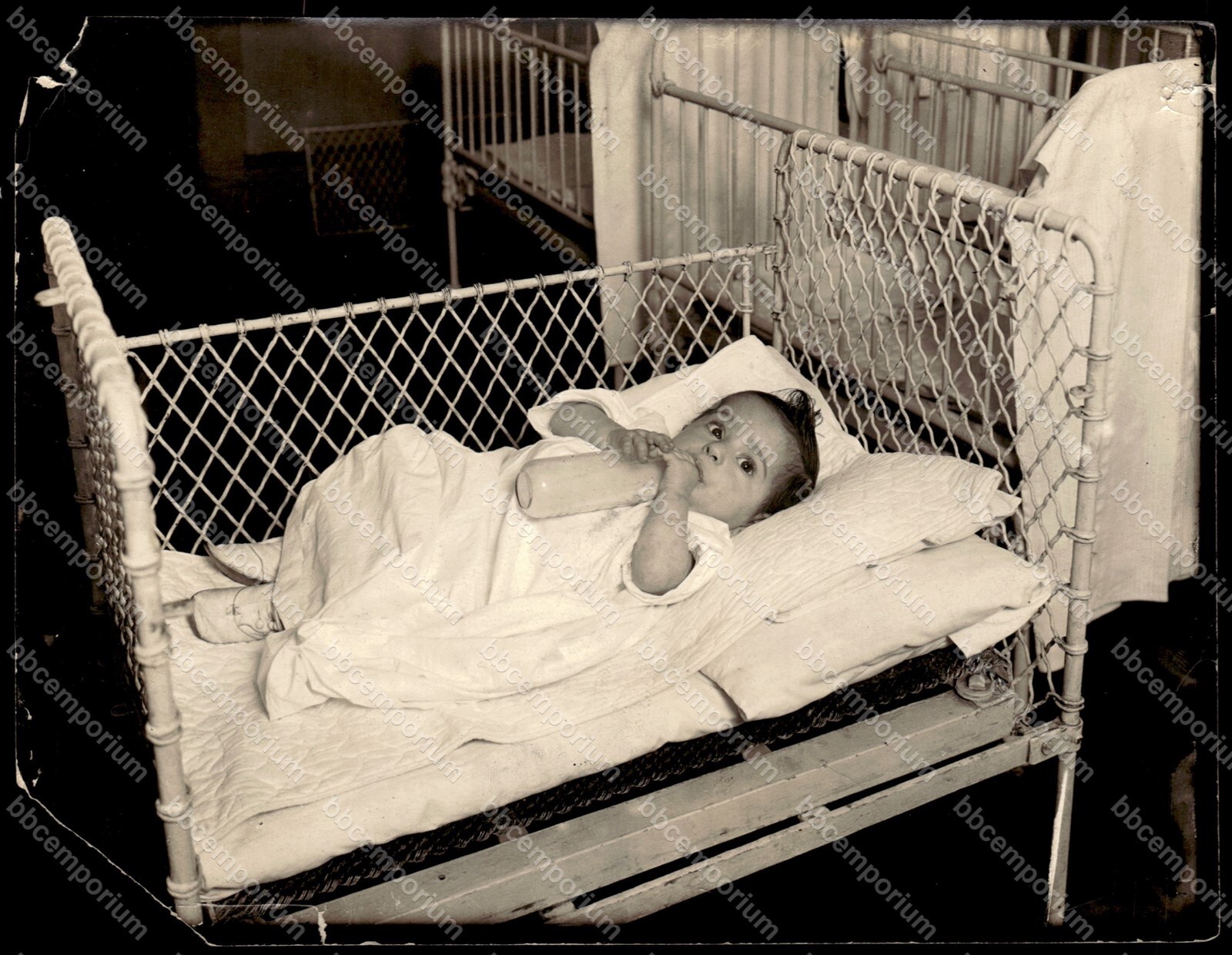 Young child in crib with bottle 6.5 x 8.5 Brown Brothers Type 1 Photograph C141