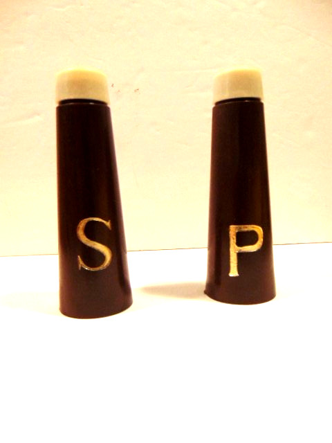 old dark brown plastic tapered salt & pepper shakers; made in Hong Kong