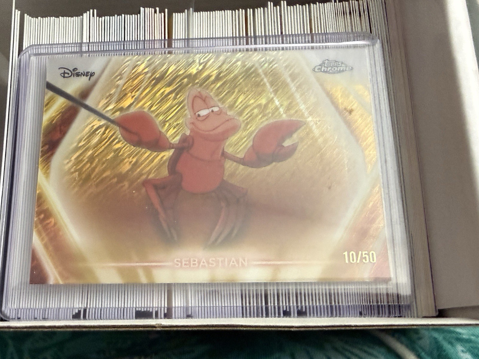 2026 Topps Disney Neon Sebastian CNE Chrome Neon-Etch Gold Shimmer /50
