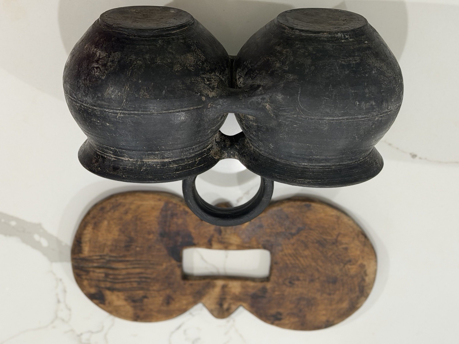 antique,specifically a ceramic double jar with a wooden lid and a black handle.
