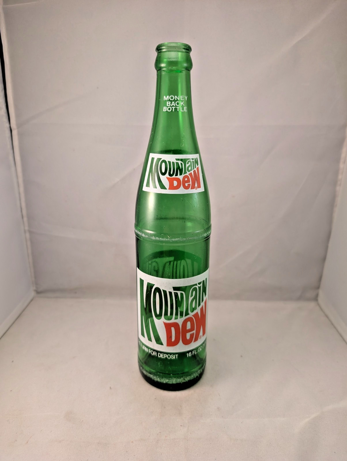 1980s Mountain Dew 16 oz money back acl painted label bottle
