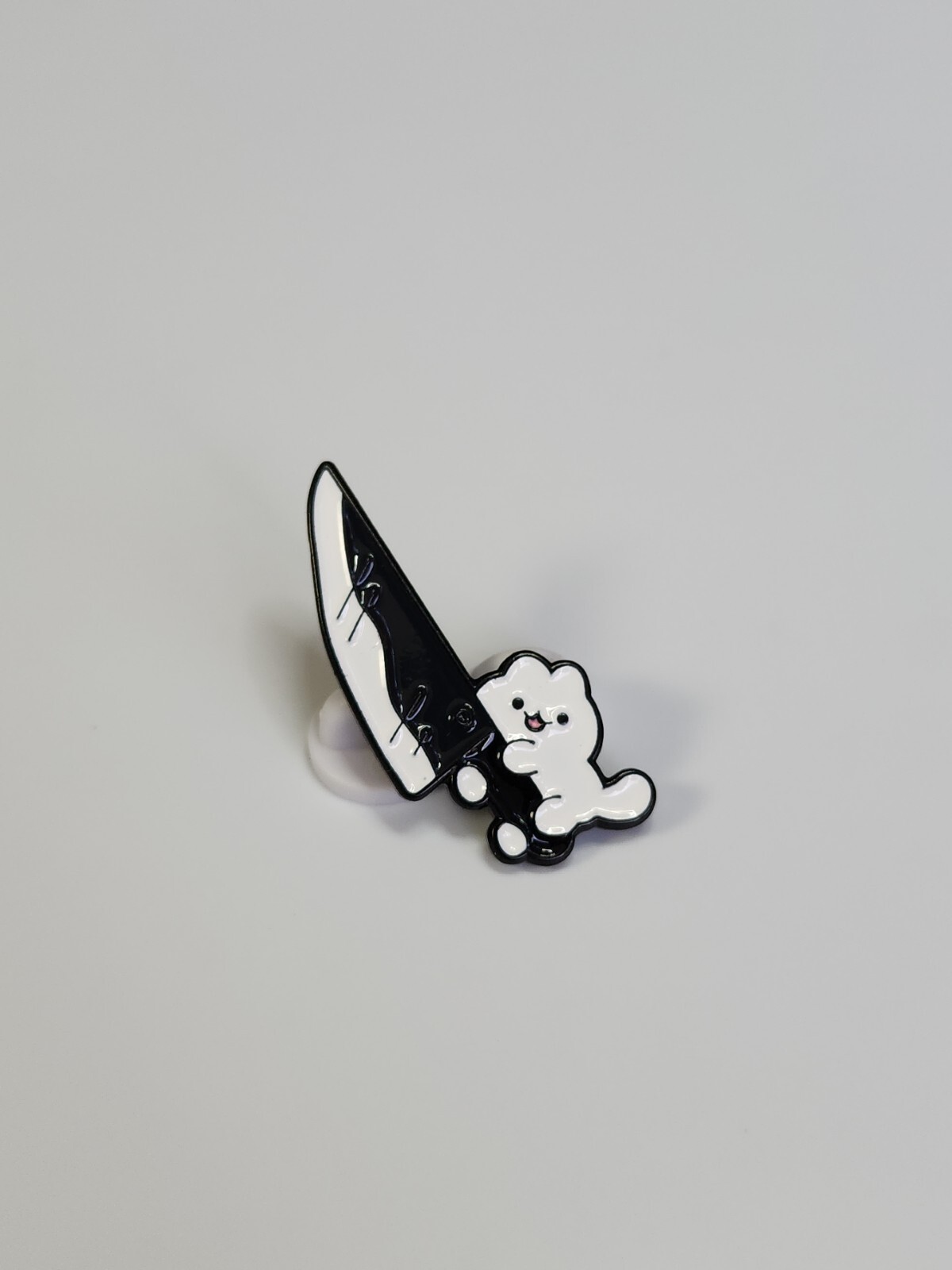 Cat Running with a Knife Lapel Pin Black & White Colors