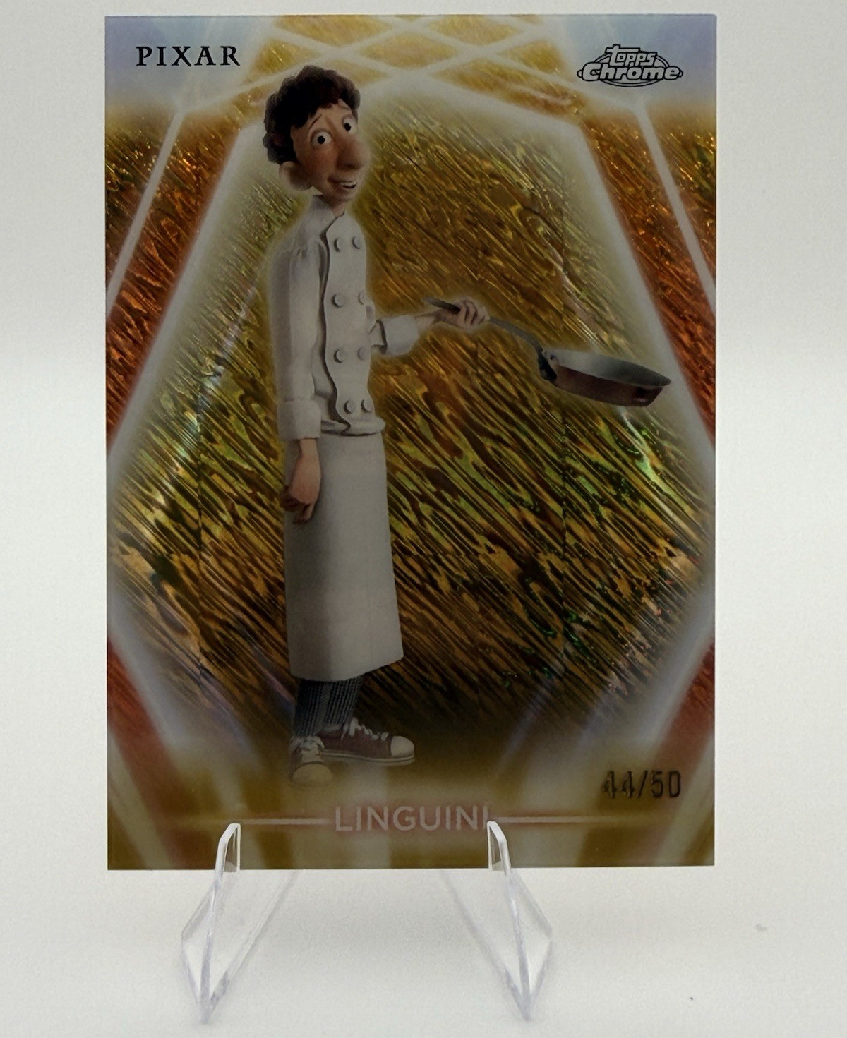 2026 Topps Disney Chrome Neon Etch Ratatouille Linguini CNE-72 Gold Shimmer /50