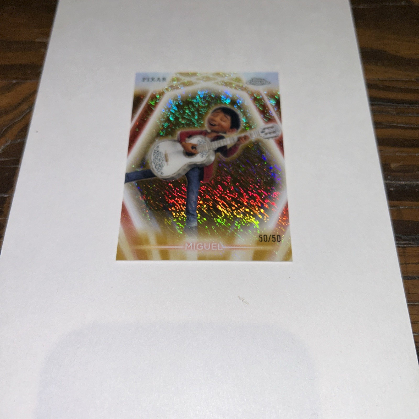 Topps 2026 Disney Neon Miguel Gold Shimmer 50/50 #CNE-65
